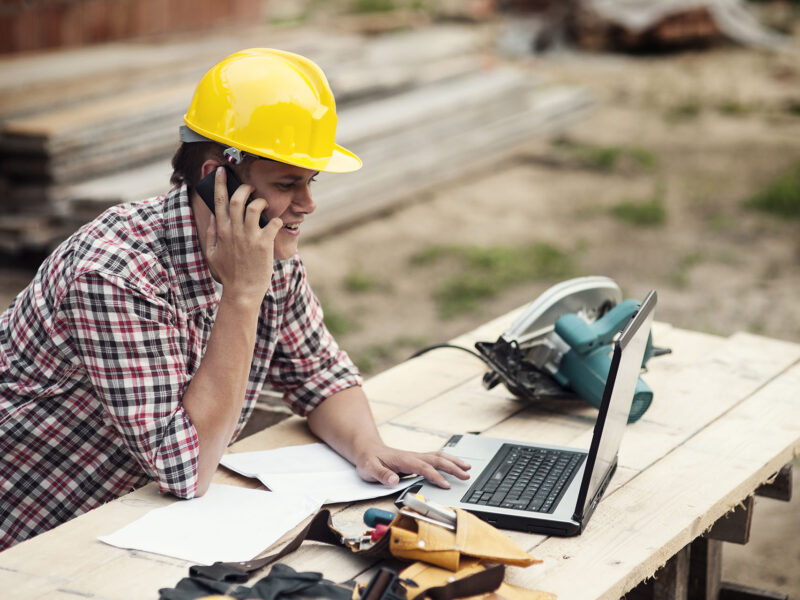 Carpenter talking on mobile phone